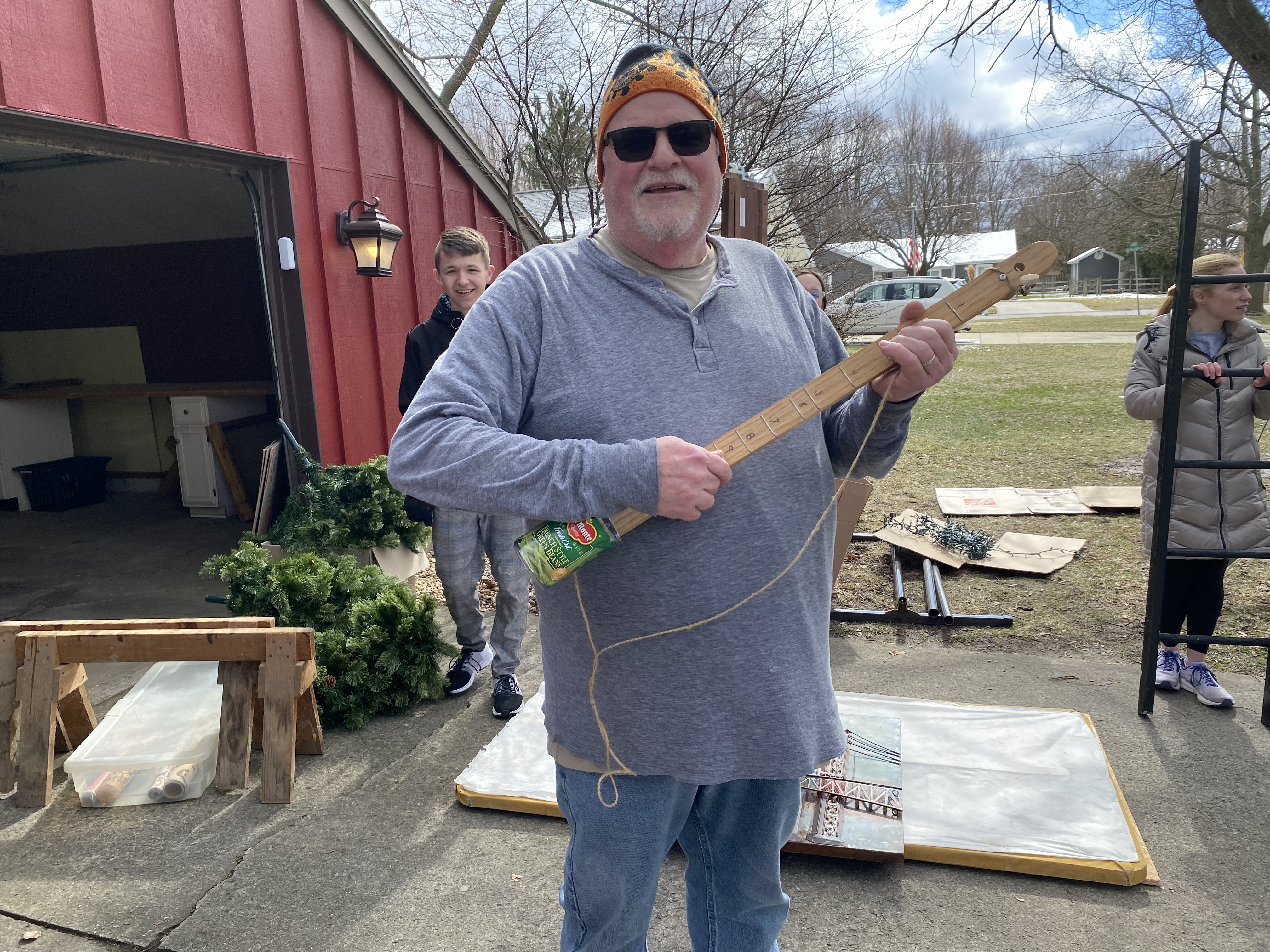 Youth Group Leader Mike Haley playing the canjo (can-banjo)