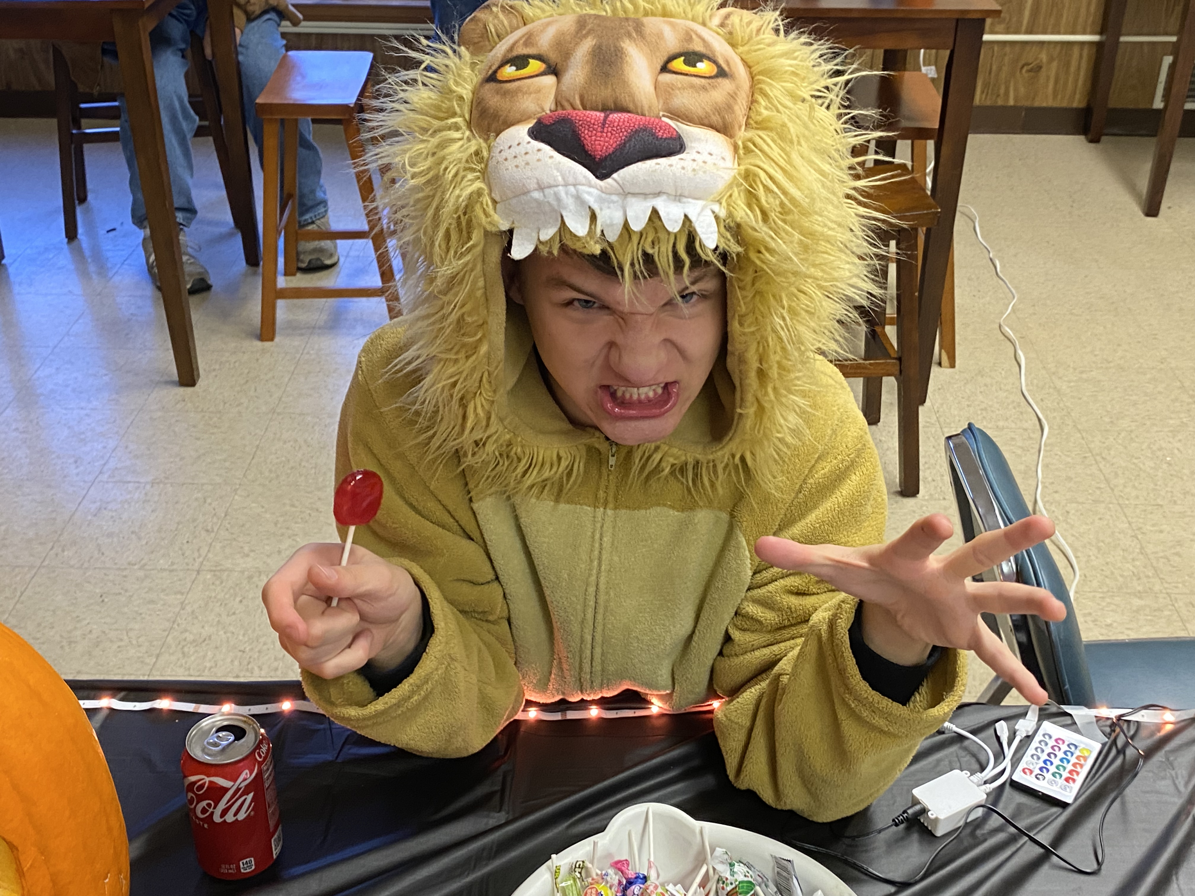 Youth Simon Baney dressed as a lion for Teen Trick or Treat