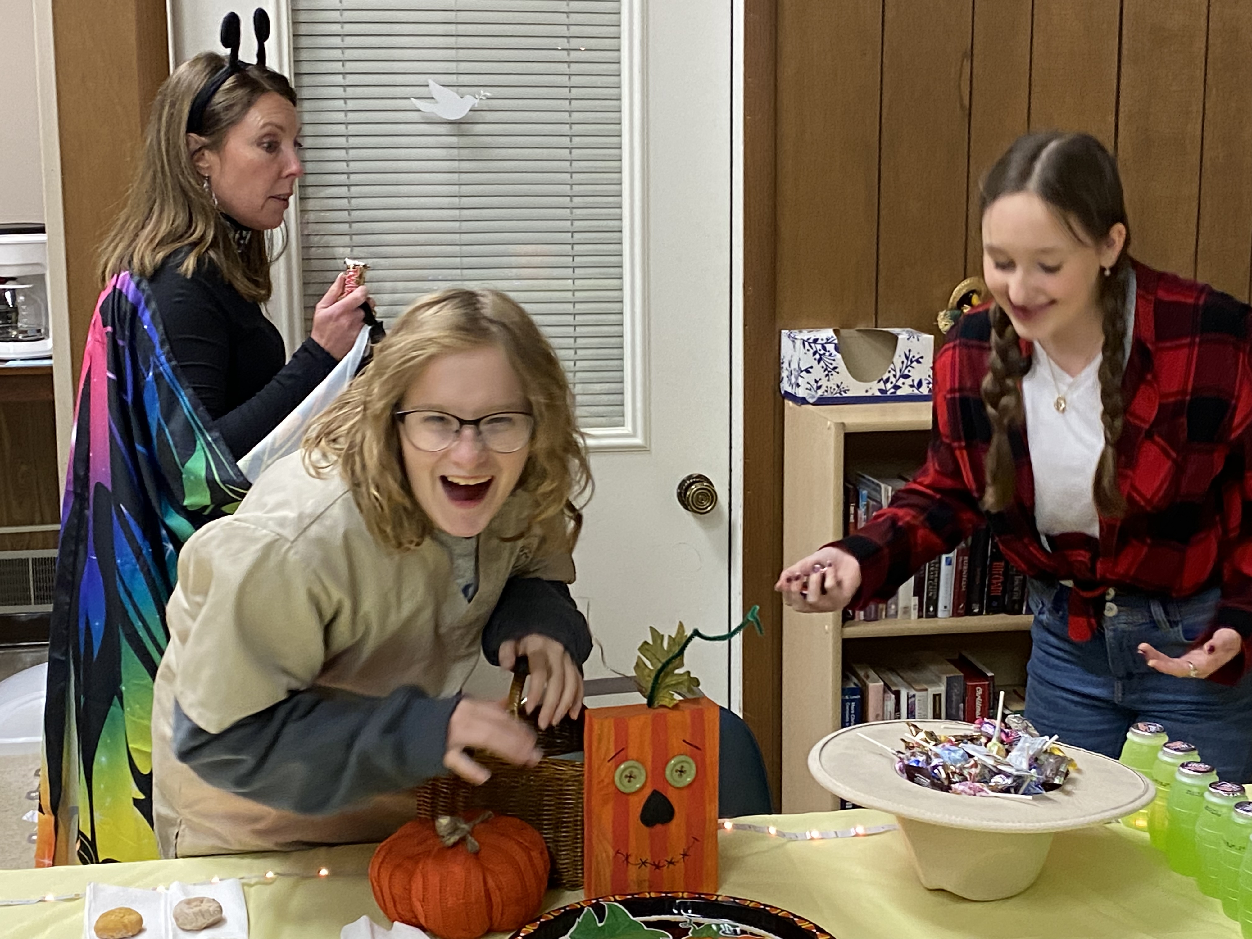 Youth leader Trisha Spadafore, Izzy, and Sophia at Teen Trick or Treat