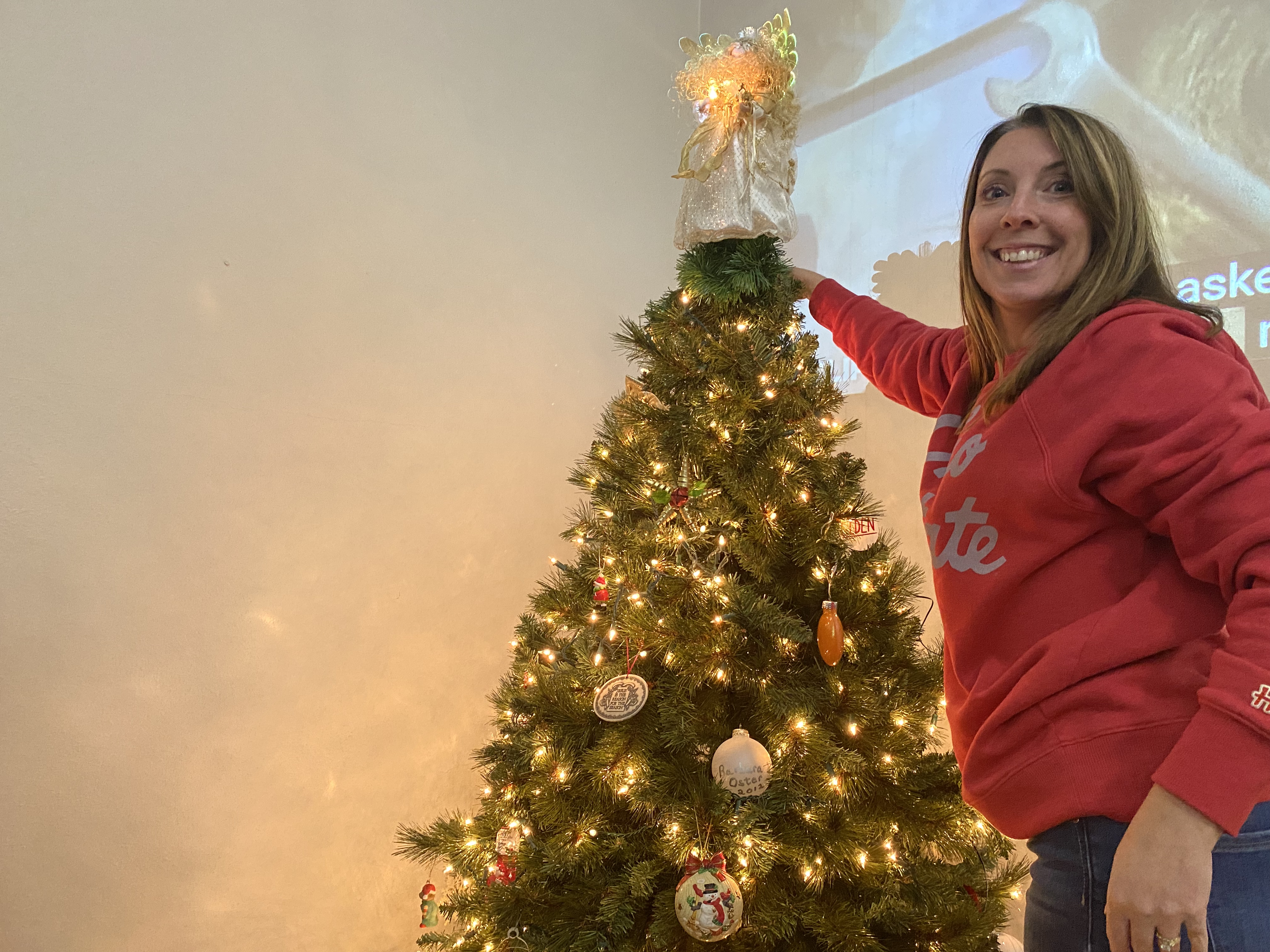 Youth Leader Trisha Spadafore decorating for Christmas