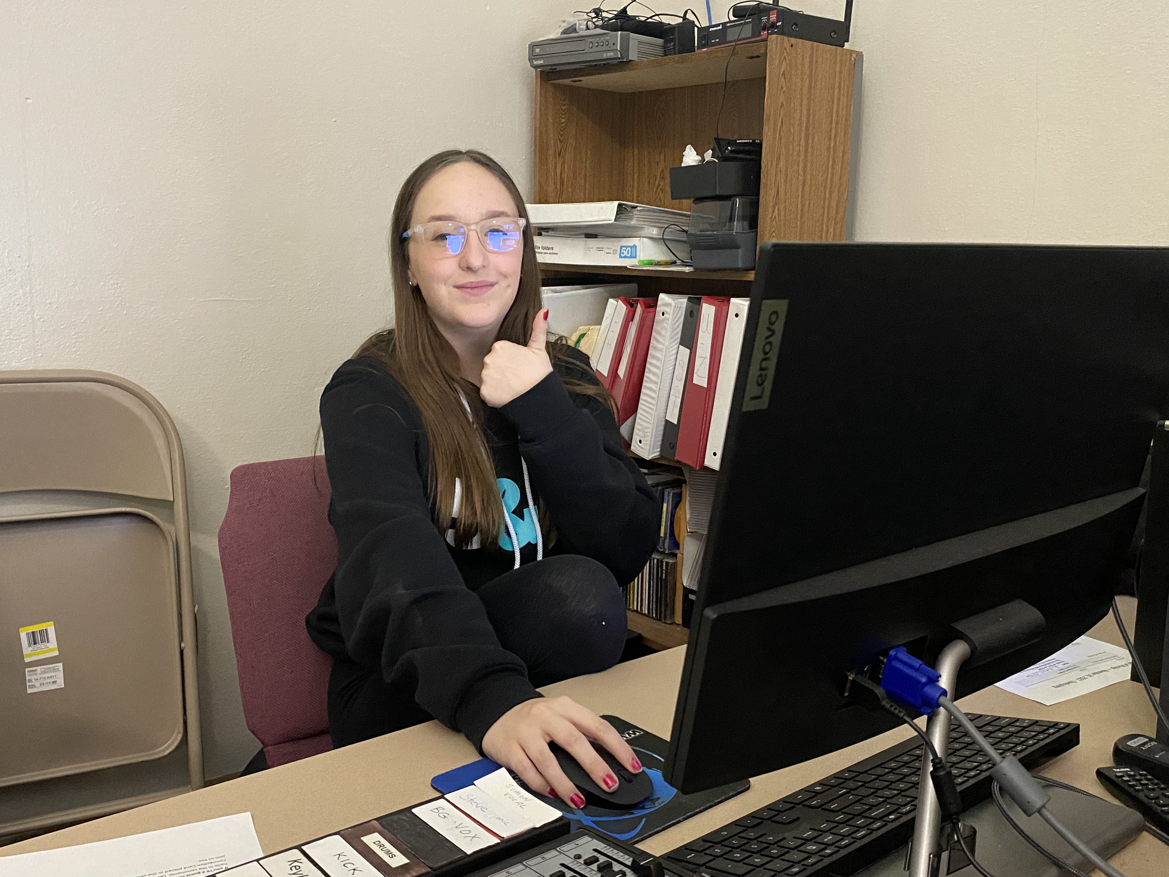 Teen Sophia Baney playing youth group music